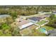 Aerial view of the home and fenced yard with surrounding trees and other neighborhood homes at 15690 Sw 46Th Cir, Ocala, FL 34473