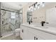 Bathroom showcasing double vanity, and glass enclosed shower with sleek fixtures at 15690 Sw 46Th Cir, Ocala, FL 34473