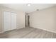This bedroom features wood floors, neutral paint and a double door closet at 15690 Sw 46Th Cir, Ocala, FL 34473