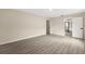 This bedroom offers wood floors, neutral paint and an open door to the bathroom at 15690 Sw 46Th Cir, Ocala, FL 34473