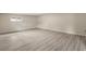 Neutral bedroom with modern floors, natural light, and calming atmosphere at 15690 Sw 46Th Cir, Ocala, FL 34473
