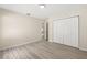 Bedroom featuring modern floors, neutral paint, and spacious closet at 15690 Sw 46Th Cir, Ocala, FL 34473