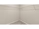 Walk-in closet featuring wire shelving and modern floors at 15690 Sw 46Th Cir, Ocala, FL 34473
