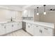 A modern kitchen with white cabinets, stylish countertops, and stainless steel appliances at 15690 Sw 46Th Cir, Ocala, FL 34473