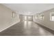 Large living room featuring tile flooring, plenty of windows and neutral colors at 15690 Sw 46Th Cir, Ocala, FL 34473