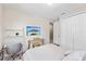 Bright bedroom features a desk, shelves, and a closet for storage at 16013 Silver Brook Way Way, Winter Garden, FL 34787