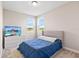 Cozy bedroom with plush carpet and a serene view from the double windows at 16013 Silver Brook Way Way, Winter Garden, FL 34787