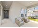 Inviting front porch with comfortable seating area and stylish decor at 16013 Silver Brook Way Way, Winter Garden, FL 34787