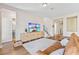 Open living room with a modern couch and a view of the stairwell and guest bathroom at 16013 Silver Brook Way Way, Winter Garden, FL 34787