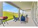 Covered patio with outdoor seating and grill overlooking a lush, green lawn at 16013 Silver Brook Way Way, Winter Garden, FL 34787
