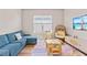 Cozy playroom with a sectional sofa, wicker chair, and kid-friendly furniture at 16013 Silver Brook Way Way, Winter Garden, FL 34787