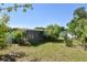 Lush backyard with ample space and mature trees, creating a private retreat at 1732 Oasis Ave, Deltona, FL 32725