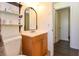 Bathroom with vanity and a mirror above the sink, with an open door at 1732 Oasis Ave, Deltona, FL 32725
