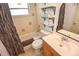 Traditional bathroom featuring a bathtub and decorative shelves above the toilet at 1732 Oasis Ave, Deltona, FL 32725