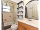Bright bathroom with a tub, toilet, and vanity, offering a functional and clean space at 1732 Oasis Ave, Deltona, FL 32725
