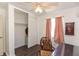 Bedroom featuring hardwood floors, ceiling fan and ample closet space at 1732 Oasis Ave, Deltona, FL 32725