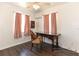 Bedroom featuring hardwood floors and a ceiling fan at 1732 Oasis Ave, Deltona, FL 32725
