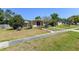 Charming single-story home featuring a well-maintained lawn, a walkway, and simple landscaping at 1732 Oasis Ave, Deltona, FL 32725