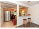 Open kitchen featuring stainless steel appliances and a breakfast bar at 1732 Oasis Ave, Deltona, FL 32725
