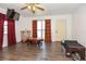 Cozy living room with hardwood floors, neutral walls, and lots of natural light at 1732 Oasis Ave, Deltona, FL 32725