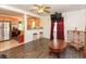Open concept living space adjacent to the kitchen with hardwood floors at 1732 Oasis Ave, Deltona, FL 32725