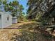 Large backyard with a wooden deck and plenty of green space at 204 Holland St, Lake Wales, FL 33859