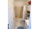 Cozy bathroom with shower-tub, classic vanity, and blue patterned flooring at 204 Holland St, Lake Wales, FL 33859