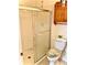 Bathroom featuring a glass-enclosed shower and toilet with decorative accents at 204 Holland St, Lake Wales, FL 33859