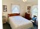 Cozy bedroom with a comfortable bed, dresser, and traditional décor at 204 Holland St, Lake Wales, FL 33859