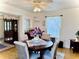 Charming dining area featuring a round table with upholstered chairs and ample natural light at 204 Holland St, Lake Wales, FL 33859