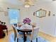 Formal dining area with hardwood floors, a round table, and natural light at 204 Holland St, Lake Wales, FL 33859
