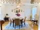 Cozy dining room with a round table, elegant chairs, and decorative mirror at 204 Holland St, Lake Wales, FL 33859