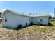 View of the home's exterior with siding and the AC units at 204 Holland St, Lake Wales, FL 33859