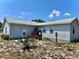 Charming home exterior with a well-manicured front yard and inviting entryway at 204 Holland St, Lake Wales, FL 33859