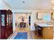 View of eat-in kitchen with island and view to dining area in this open concept living space at 204 Holland St, Lake Wales, FL 33859