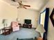 Comfortable living area featuring a TV, accent chair, and natural light, perfect for relaxing and entertaining guests at 204 Holland St, Lake Wales, FL 33859