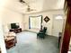 Cozy living room with large window, ceiling fan, and comfortable seating arrangement, creating a relaxing space at 204 Holland St, Lake Wales, FL 33859