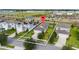 Overhead shot of home, outlining the property and showcasing the surrounding community at 2130 Bur Oak Blvd, St Cloud, FL 34771