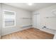 This bedroom has hard wood floors, a window, a closet, and built-in shelving at 2130 Bur Oak Blvd, St Cloud, FL 34771