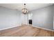 Bedroom featuring wood floors, gray walls with star decals and a modern light fixture at 2130 Bur Oak Blvd, St Cloud, FL 34771