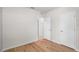 Bedroom with wood flooring, white walls, and two doors at 2130 Bur Oak Blvd, St Cloud, FL 34771