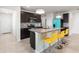 Well-equipped kitchen with island seating, granite countertops, and stainless steel appliances at 2130 Bur Oak Blvd, St Cloud, FL 34771