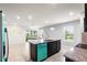 Open concept kitchen with a large island, stainless steel appliances, and an adjacent outdoor patio area at 2130 Bur Oak Blvd, St Cloud, FL 34771