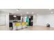 Bright open-concept kitchen with island, modern barstools, and stainless steel appliances at 2130 Bur Oak Blvd, St Cloud, FL 34771