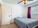 Inviting bedroom featuring a window, closet, and neutral color scheme at 2203 Beatrice Dr, Orlando, FL 32810