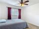 Inviting bedroom featuring a window, closet, and neutral color scheme at 2203 Beatrice Dr, Orlando, FL 32810