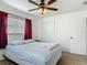 Inviting bedroom featuring a window, closet, and neutral color scheme at 2203 Beatrice Dr, Orlando, FL 32810