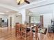 Bright dining area showcasing hardwood floors and an open layout connecting to the living room at 2203 Beatrice Dr, Orlando, FL 32810