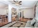 Open-concept living area with hardwood floors connecting to the kitchen and dining room at 2203 Beatrice Dr, Orlando, FL 32810