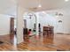 Open-concept layout with hardwood flooring, seamlessly connecting the living and dining areas at 2203 Beatrice Dr, Orlando, FL 32810